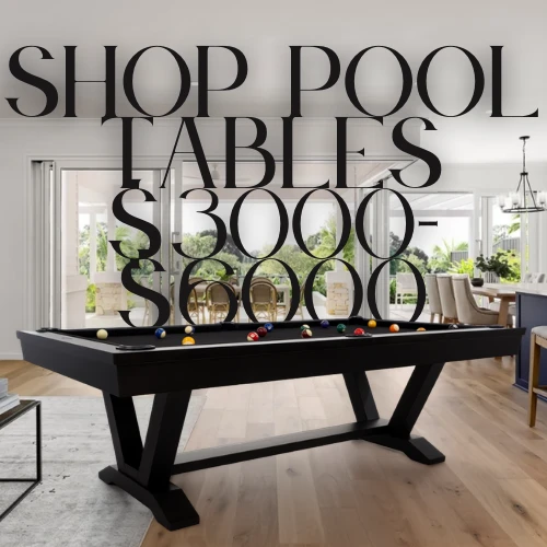 Pool table in a lvingroom with large windows
