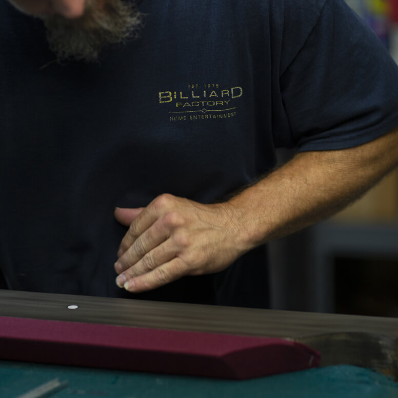 Billiard Factory installer refelting a pool table